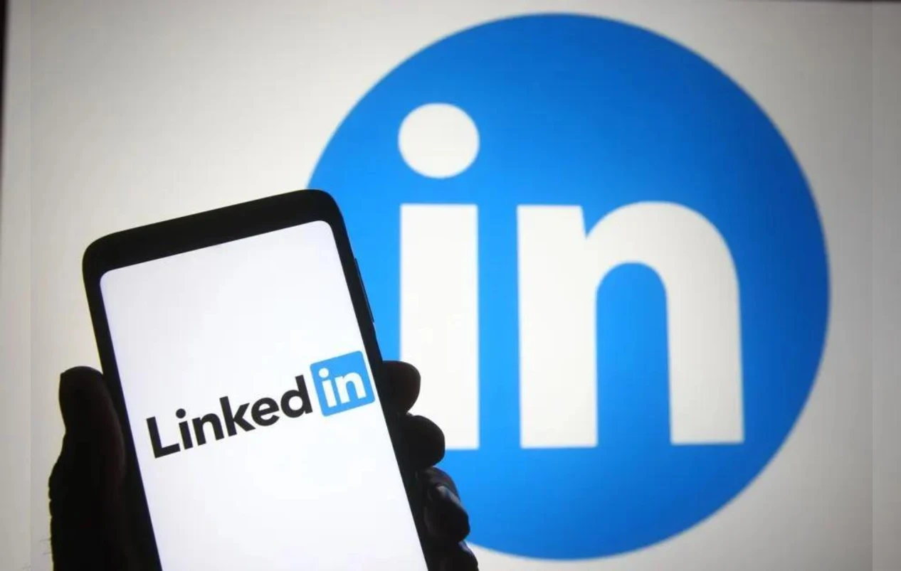 Linkedin Logo on a Mobile Phone and at the background