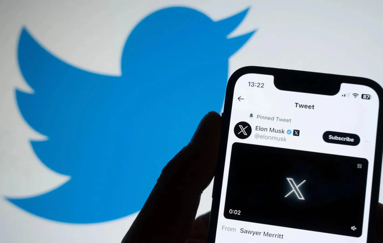 X Logo on a Mobile Phone and Twitter Logo at the Background