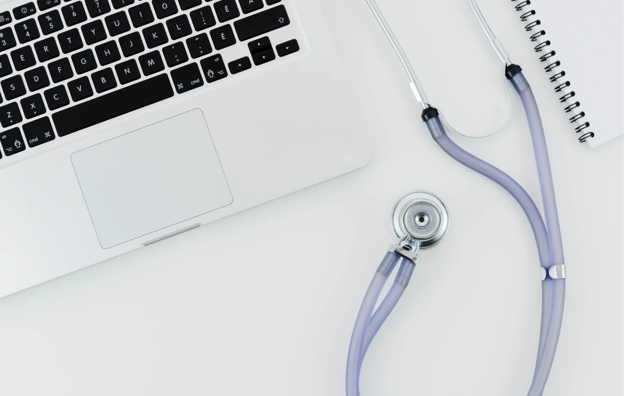 A Stethoscope Next to the Laptop Keyboard
