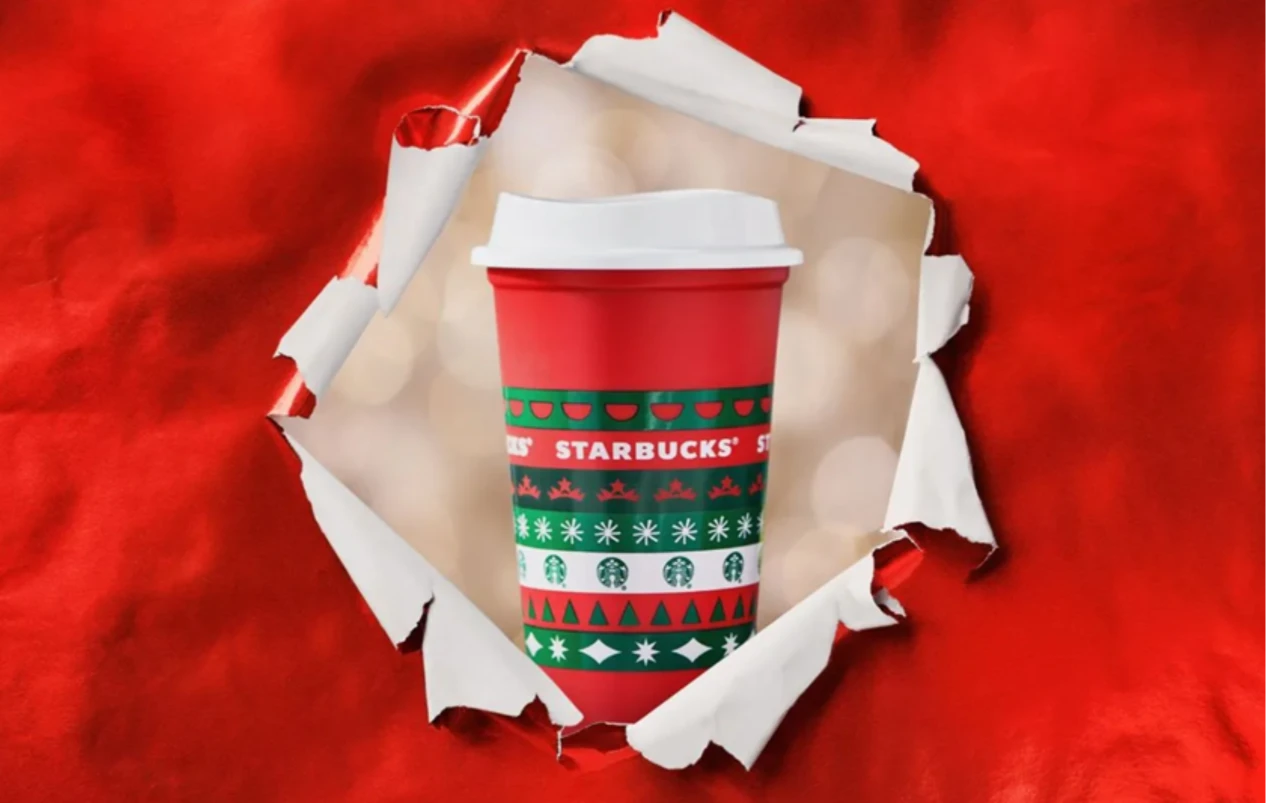 A Red Starbucks Cup on a Red Background